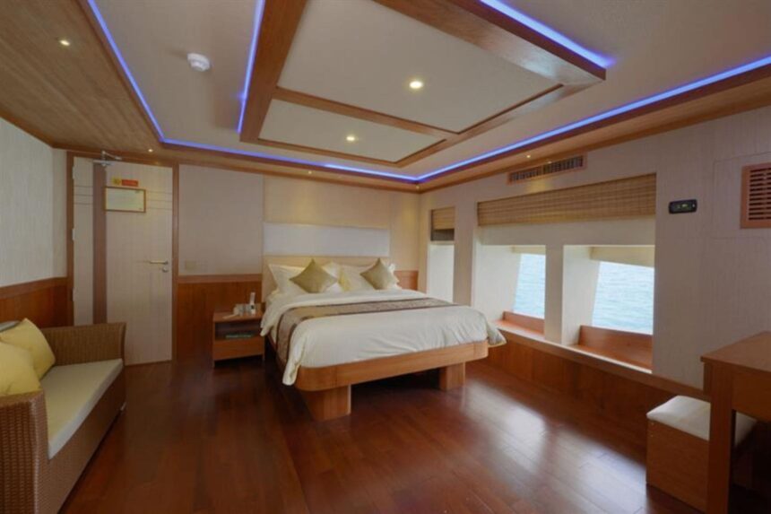 Suite bedroom on the Maldives Blue Force One with a double bed and mood lighting