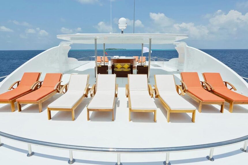Orange and cream sun loungers arranged on the Blue Force One's shaded sun deck