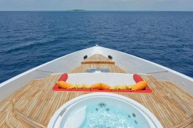 Bow deck of the Blue Force One with a hot tub and cushioned lounge seating