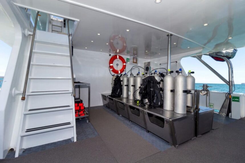 Scuba tanks and gear lined up on the Galaxy Diver's dive deck
