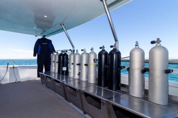 Twin cabin with a fire extinguisher and hanging towels aboard the Galaxy Diver
