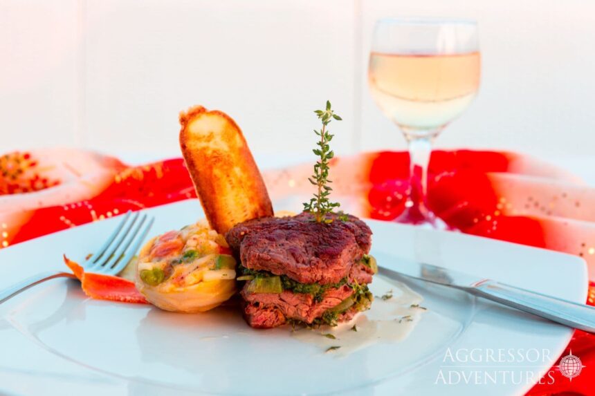 Seared steak entree with roasted potatoes and herb garnish served aboard the Red Sea Aggressor II