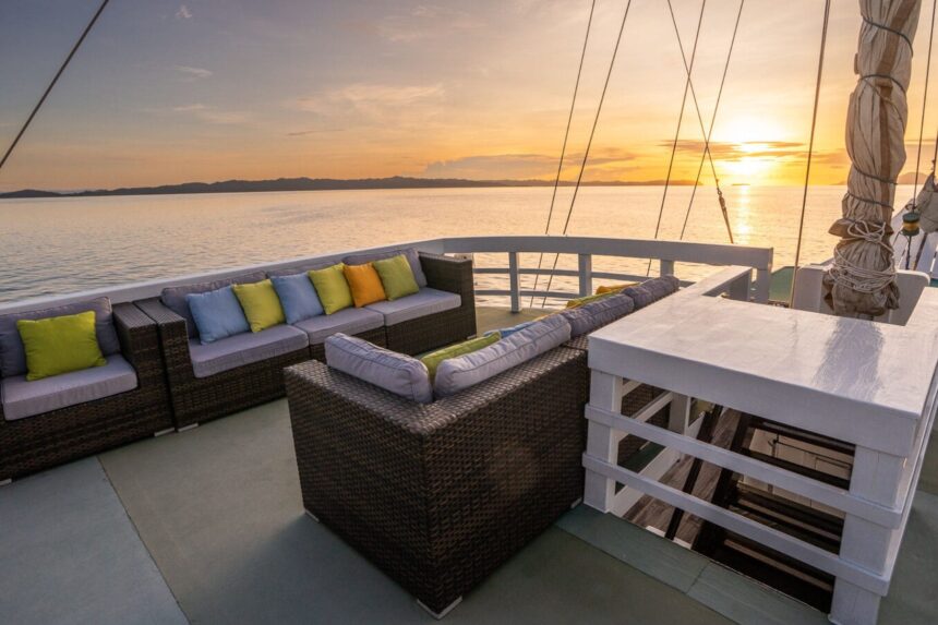 Sofa lounge seating on the Pindito's sundeck at sunset