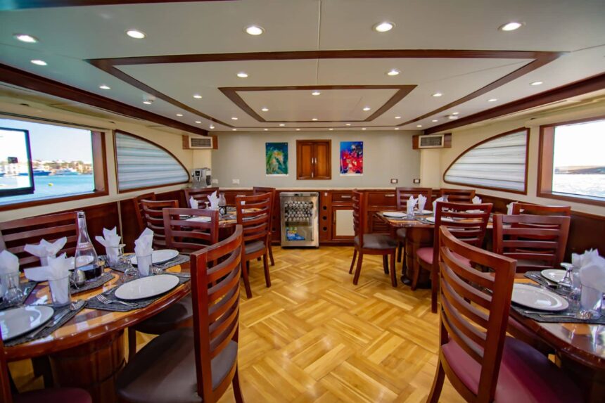 Formal dining room aboard the Emperor Asmaa with tables set for guests