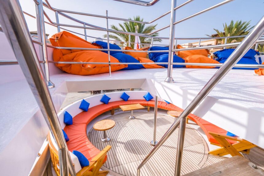 Round orange and blue cushioned lounge seating on the Emperor Asmaa's upper deck