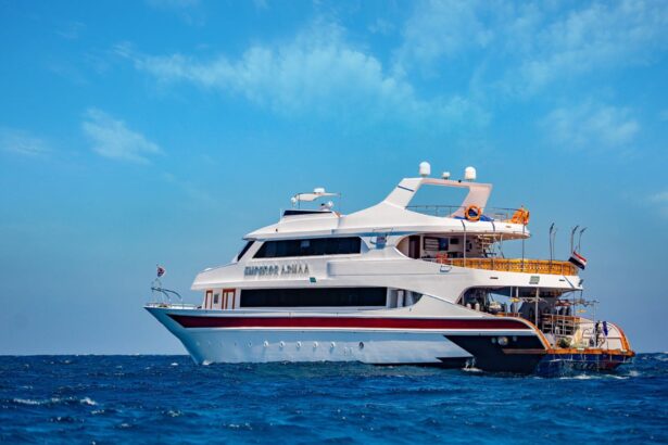 Close view of the Emperor Asmaa's twin-hull stern and dive deck at anchor