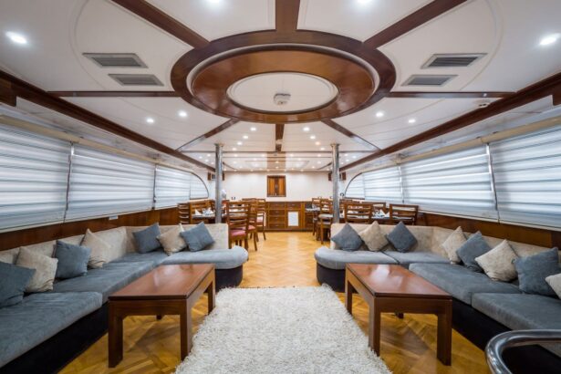Indoor lounge aboard the Emperor Asmaa with curved wood ceiling and sofas