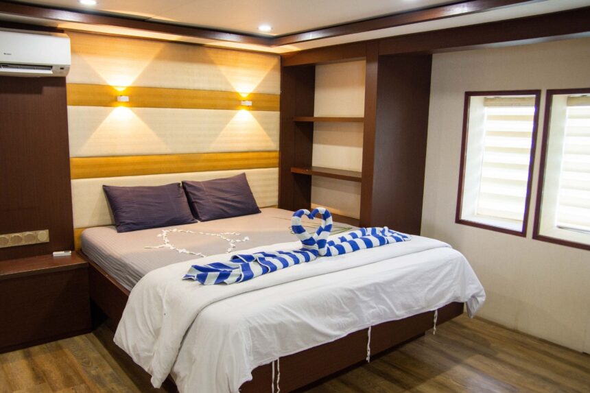 Cabin bed aboard the Emperor Serenity decorated with a heart-shaped towel design
