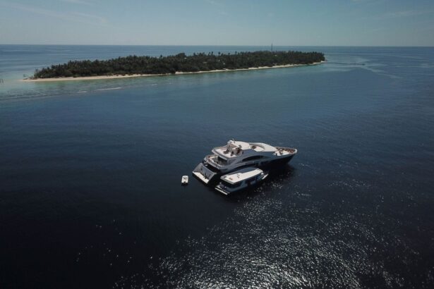 Aerial view of the Emperor Serenity moored close to a tropical island