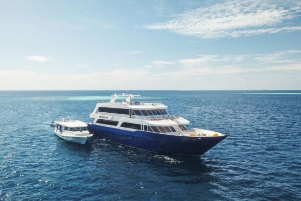The Emperor Leo liveaboard anchored beside its dive support dhoni in the Maldives