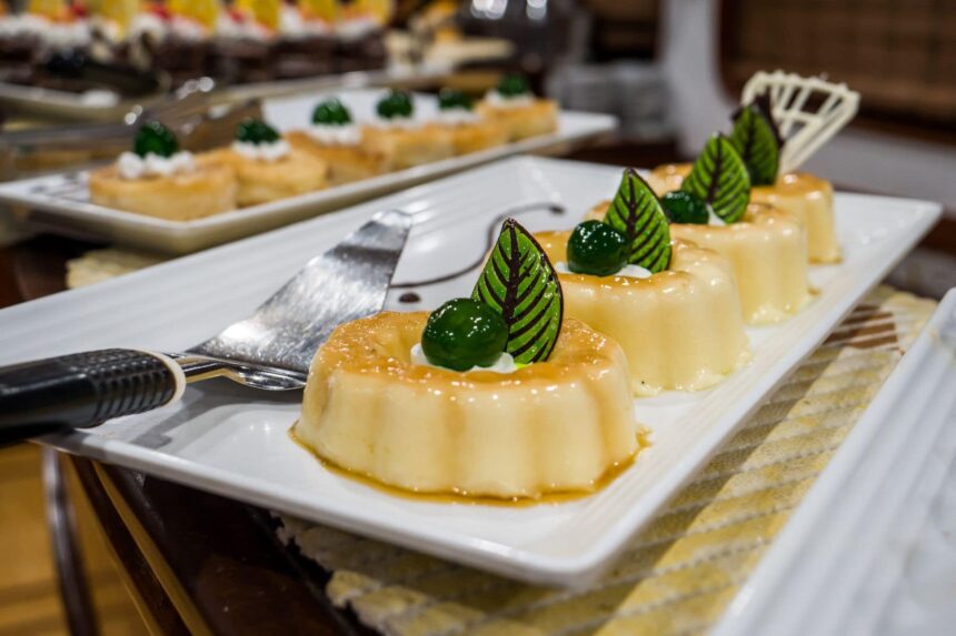 Caramel flan desserts plated for guests aboard the Emperor Superior