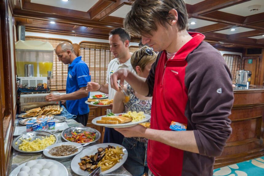 Guests serving themselves from a breakfast buffet aboard the Emperor Superior