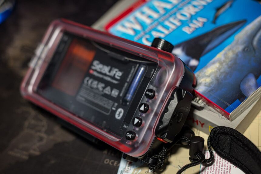 SeaLife SportDiver housing propped upright showing its clear back panel and vacuum valve knob