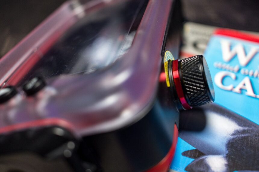 Close-up of the knurled black vacuum valve knob on the side of the SportDiver housing