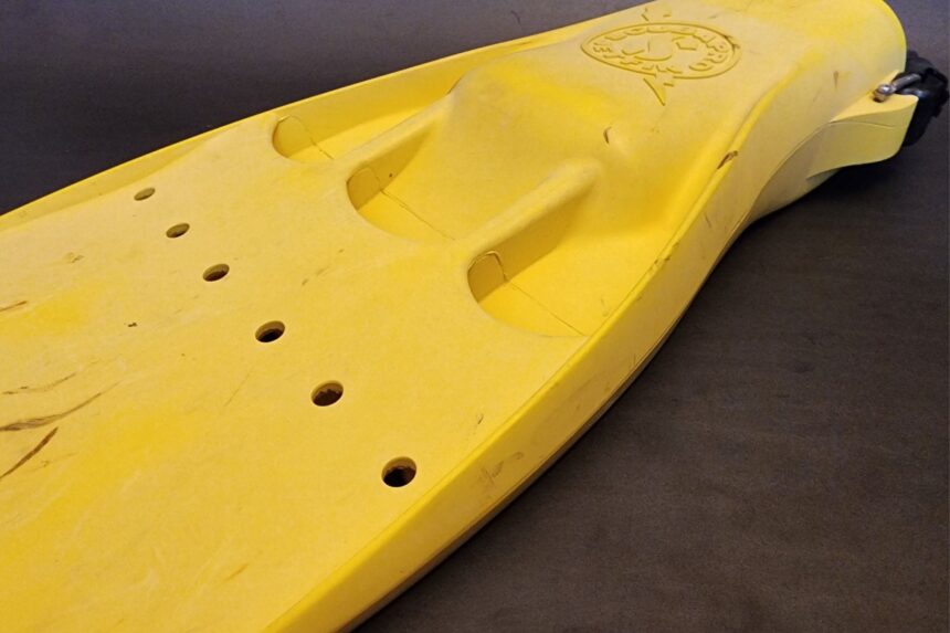 Side view of a yellow ScubaPro Jet Fin showing the short, wide rubber blade