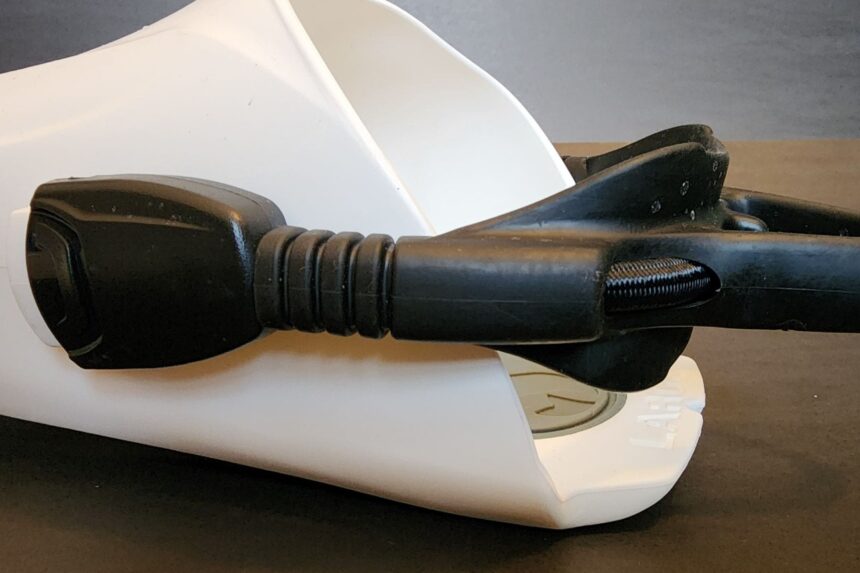 Quick-release buckle and bungee strap on the heel of a white Seawing Supernova foot pocket