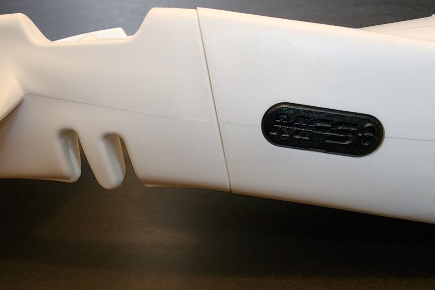 Close-up of the auto-adjust central panel on the white Seawing Supernova with its ScubaPro badge