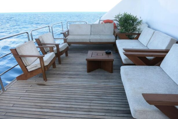 Wooden side deck with cushioned sofas and a coffee table aboard the Blue Voyager