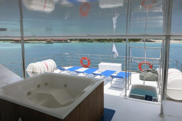 Rear sundeck with a hot tub, sun loungers and life rings on the Blue Voyager