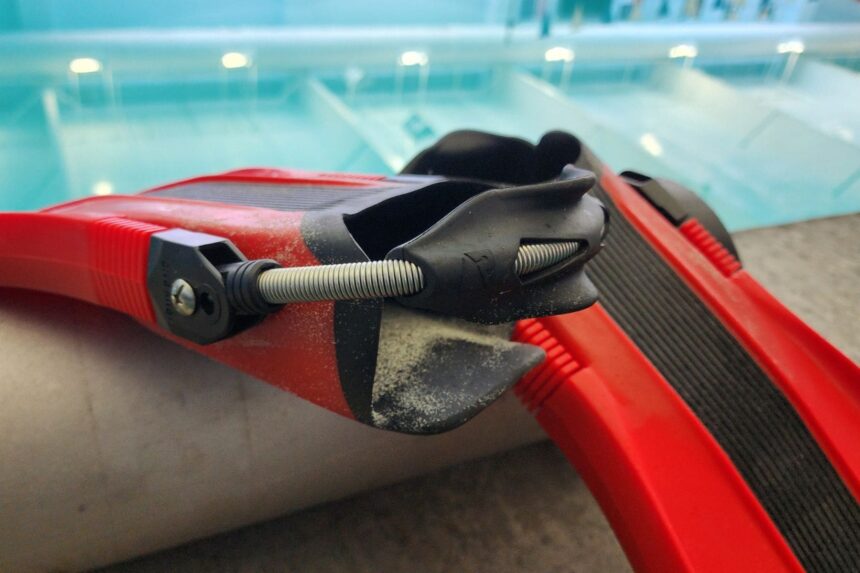Spring strap and heel pad of the Dive Rite XT fin photographed at the pool test site