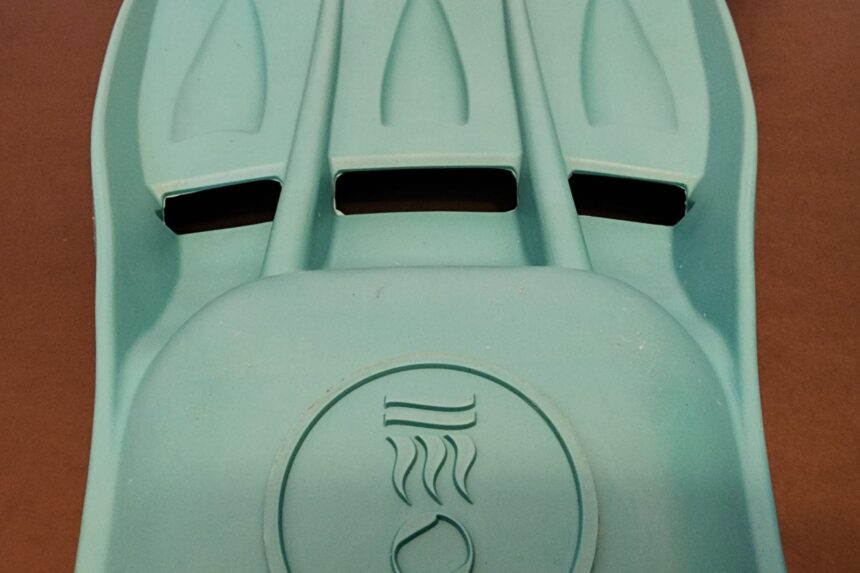 Underside of the Tech fin blade with three vent slots and the Fourth Element logo