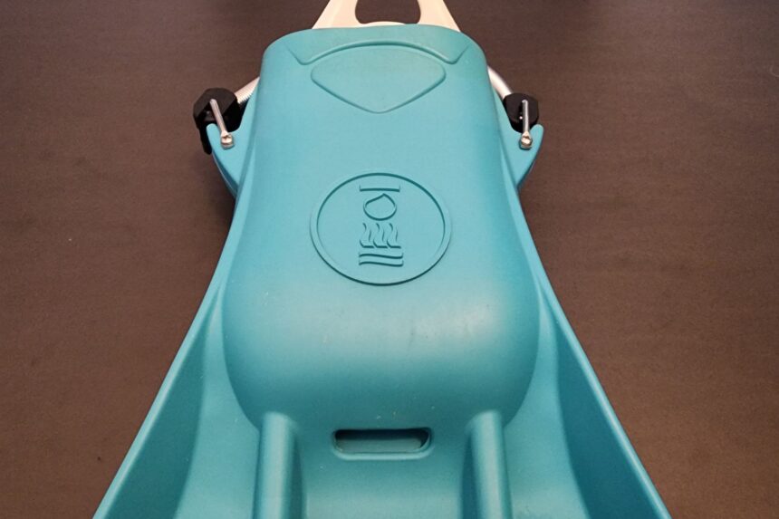 Top of the Fourth Element Tech fin foot pocket with the brand logo and spring straps