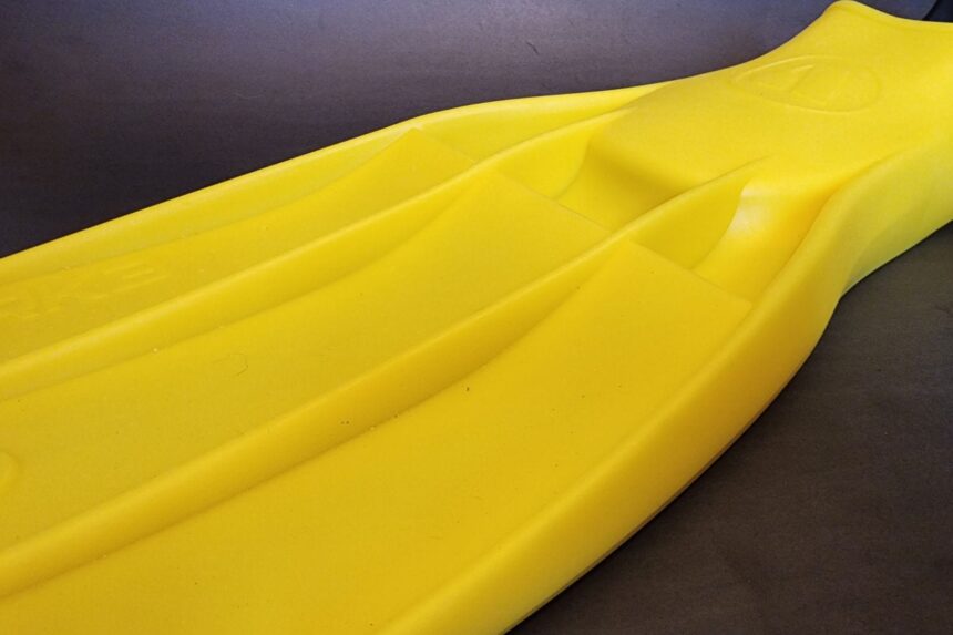 Close-up of the channelled blade on a yellow Apeks RK3 fin