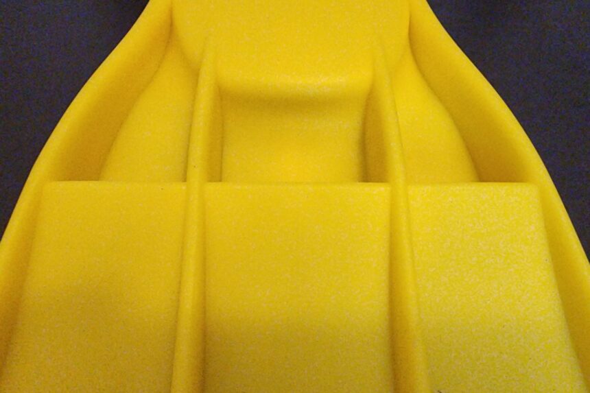 Macro view of the moulded channels running down a yellow Apeks RK3 fin blade