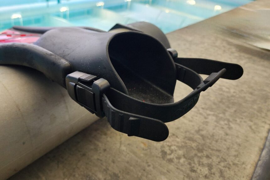 Close-up of the foot pocket and open heel strap on an Atomic Aquatics SplitFin at the poolside