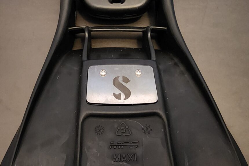 Stainless steel weight plate bolted into the blade of the ScubaPro S-Tek fin