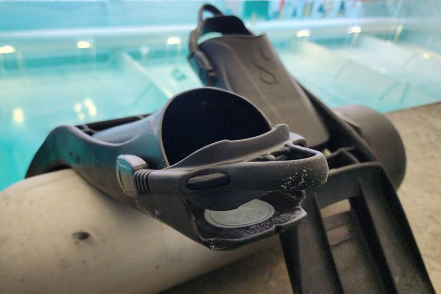 S-Tek Fins Poolside Before Testing ScubaPro S-Tek fins resting on a cylinder at the edge of the pool during DIVEIN testing