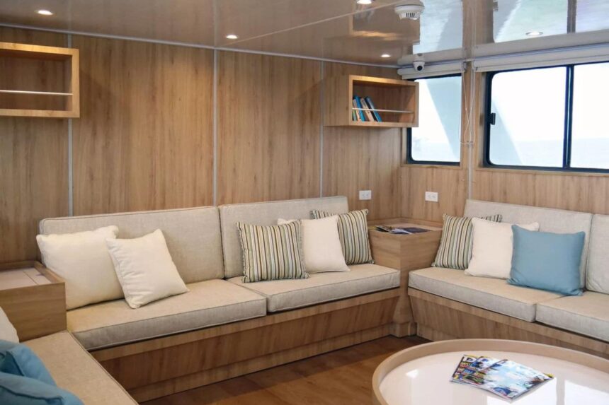 Wraparound couch and cushions in the Aqua liveaboard's lounge area