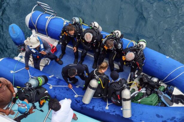 Divers gearing up on the Aqua's inflatable tender before entering the water