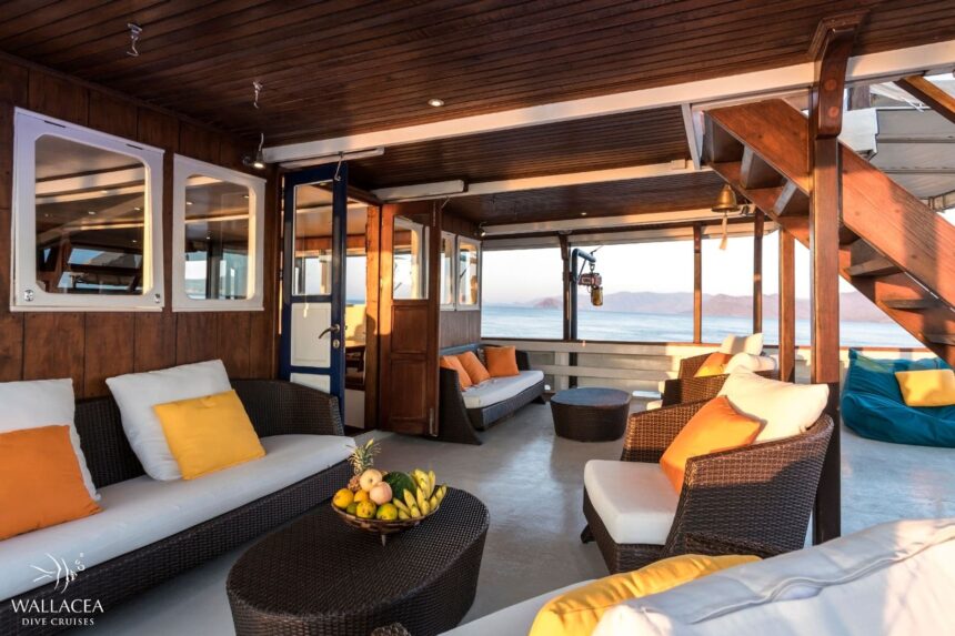 Sun deck of the Ambai with steps, blue bean bags, and ocean views