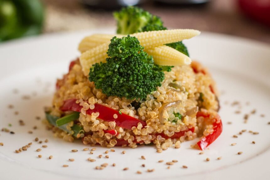 plated quinoa dish topped with broccoli and baby corn on the Galapagos Sky