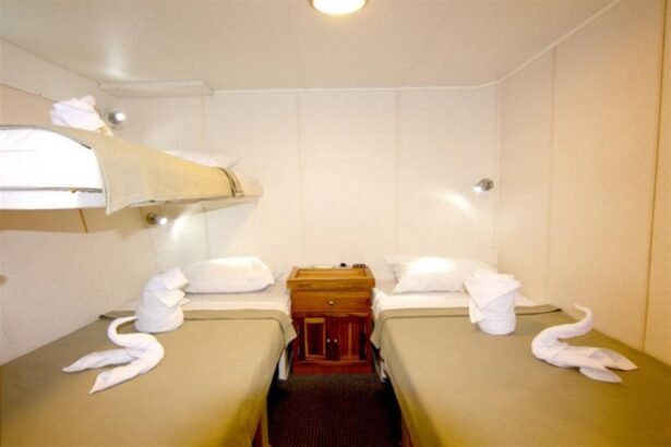 twin cabin aboard the Nortada with bunk berths and towel swans on the beds