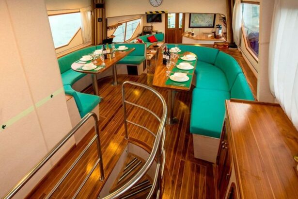 teal booth seating around dining tables in the Nortada's saloon