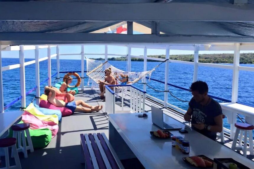 guests relax in a hammock and beanbags on the Epica's shaded deck
