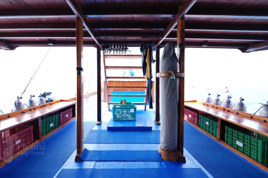 dive deck with scuba tanks and gear crates aboard Lady Denok