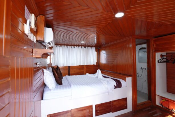 wood trimmed double cabin bed aboard Lady Denok