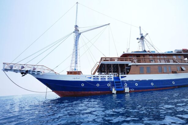 Lady Denok docked alongside another sailing vessel