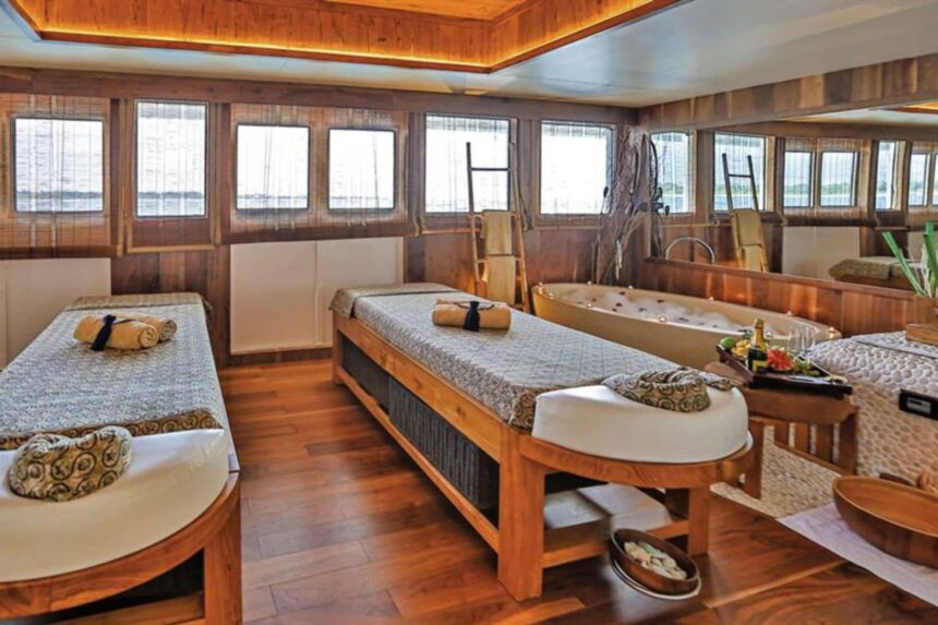 Twin massage beds and a soaking tub inside the Scubaspa Yang spa