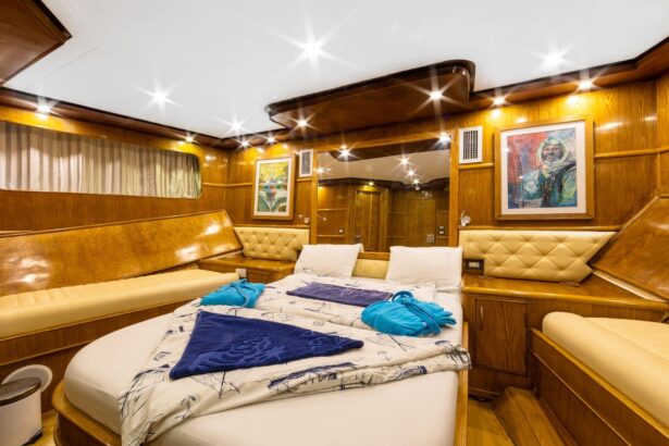 Double bed cabin with colorful artwork aboard the Aphrodite