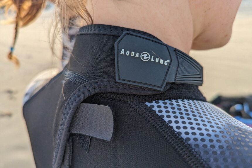 Close-up of the Aqualung logo badge and velcro neck closure on the HydroFlex wetsuit collar
