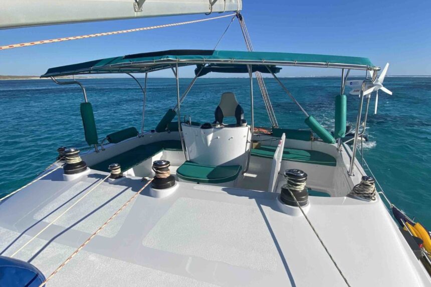The bow deck and helm seating area of the Shore Thing catamaran