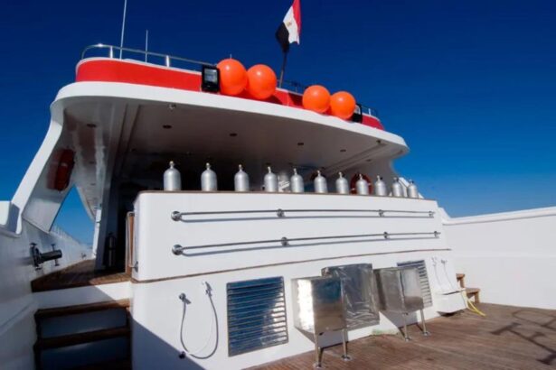 Close-up of the Aldebaran's rear deck with scuba tanks and orange buoys