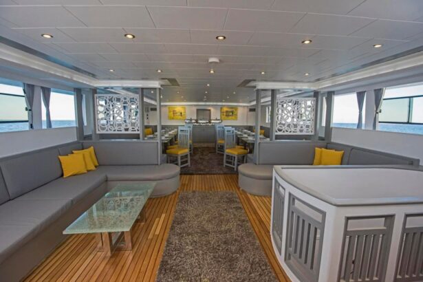 Grey and yellow lounge seating in the Discovery II indoor salon