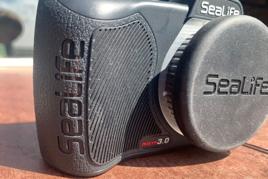 SeaLife Micro 3.0 with its lens cap fitted, showing the textured grip and ribbed thumb pad