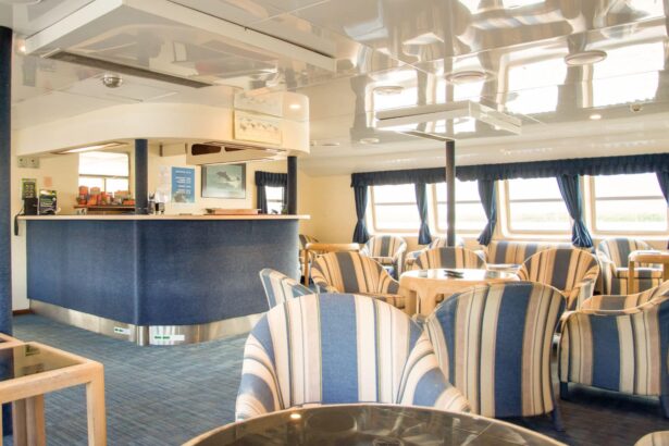 Blue and cream striped armchairs around the bar in the OceanQuest lounge