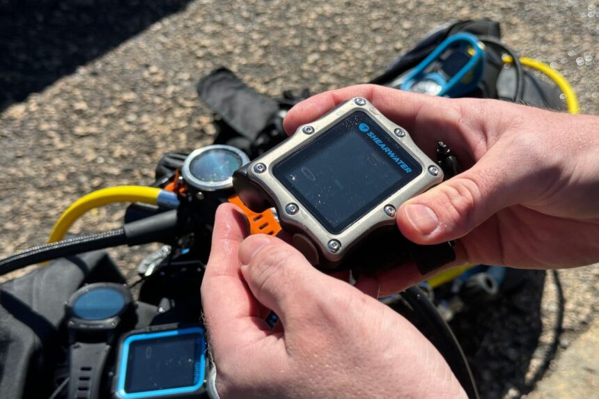 Preparing the Shearwater dive computers for several in-water tests.